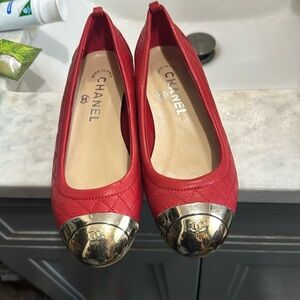 Red Chanel silver toe ballerina style shoes